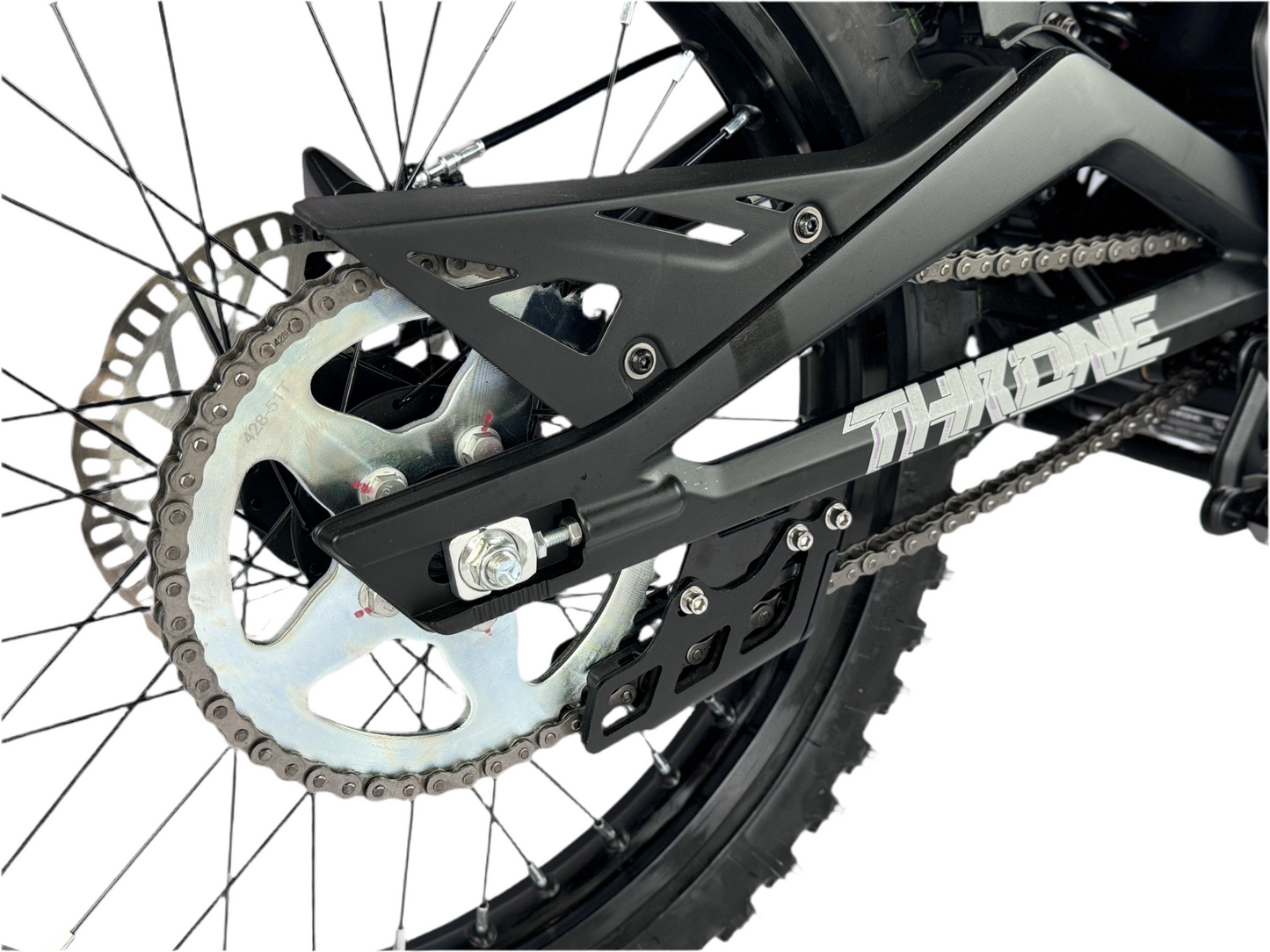 Close-up of a bicycle chain and sprocket system on a white background