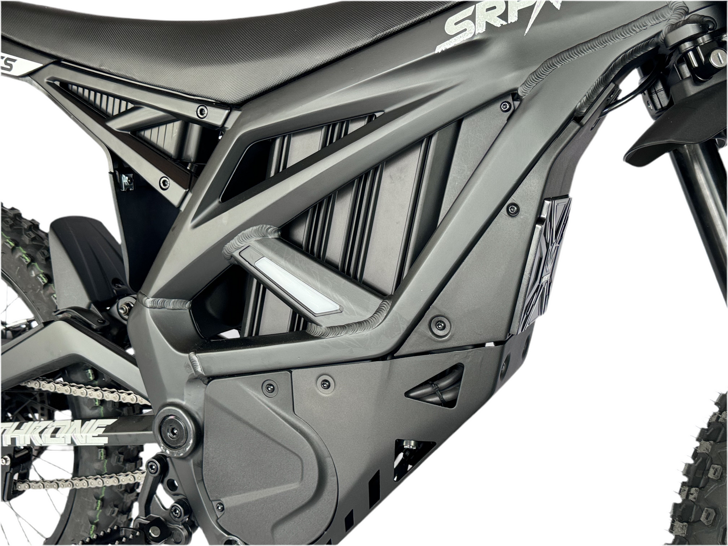 Close-up of a motorcycle frame with 'SRP' branding on a white background