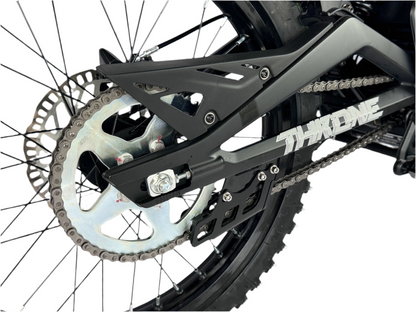 Close-up of a bicycle chain and sprocket system on a white background
