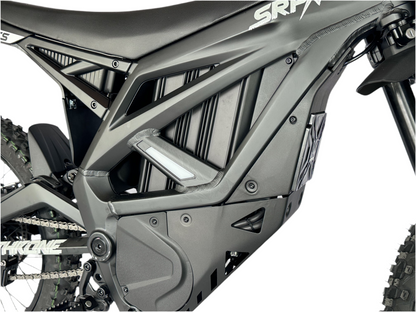 Close-up of a motorcycle frame with 'SRP' branding on a white background